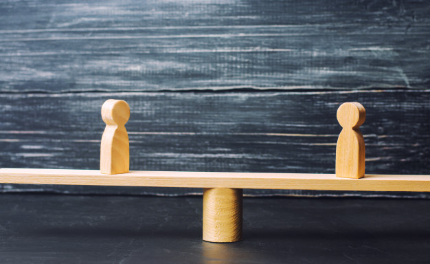 two-wooden-figures-stand-scales-justice_72572-694