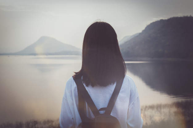 beautiful-asia-woman-teen-girl-looking-river-with-lonely_35934-19