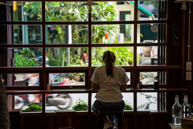 woman-sitting-bar-alone-enjoy-her-dessert-cafe_28890-291