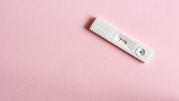 pregnancy-test-with-pregnant-result-pink-background_33779-28
