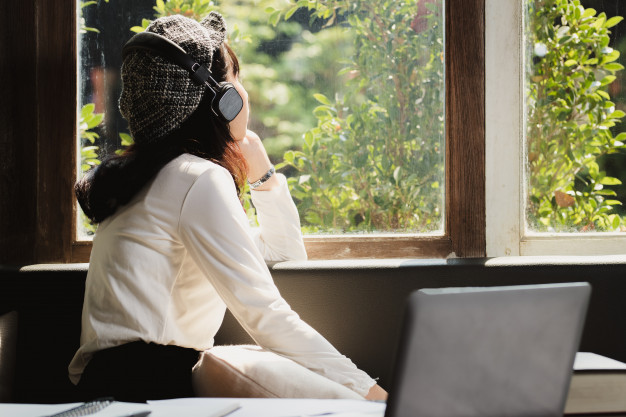 asia-woman-listening-music-with-lonely_35934-455