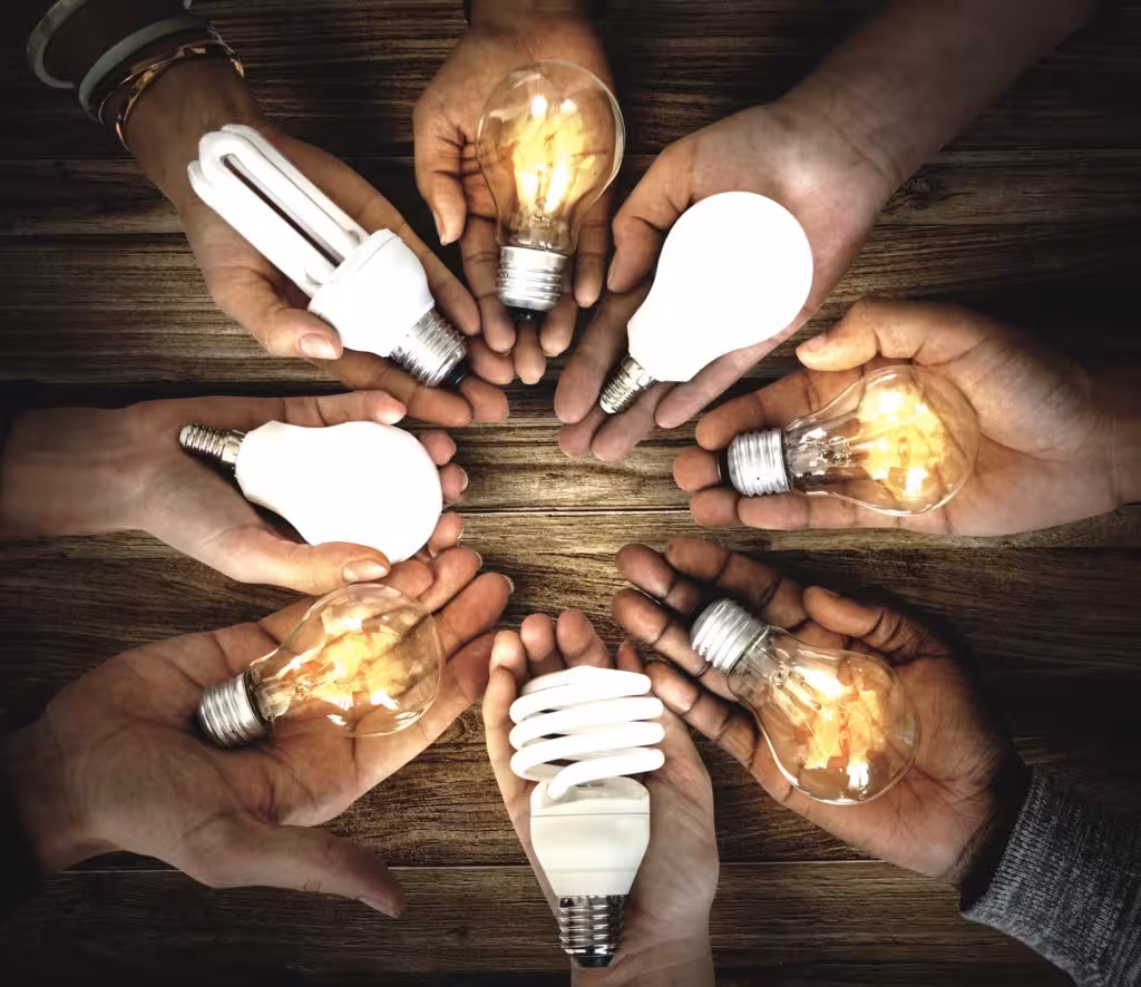Hands Show Light Bulb Ideas Together Partnership
