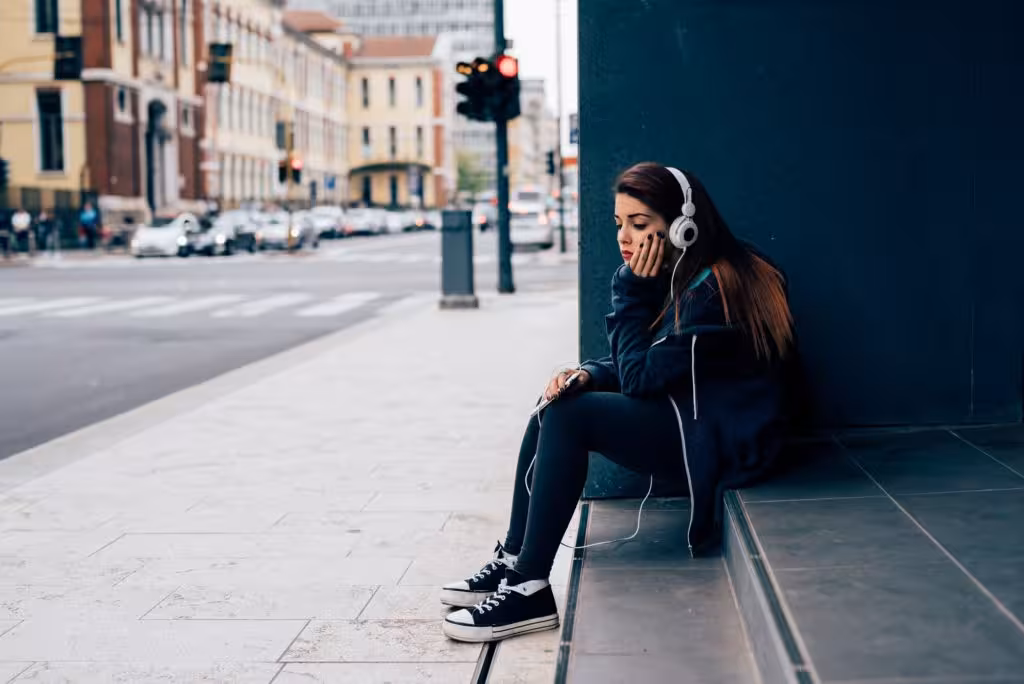 Young woman sitting on a step
